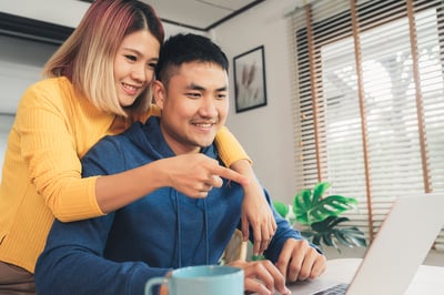 Couple Looking at Home Listings 