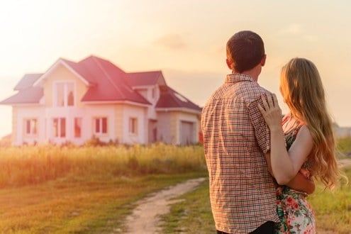 Couple Looking at Farm House From the Outside