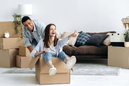 Couple moving into their Massachusetts home after obtaining a first-time homebuyer mortgage