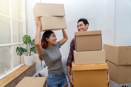 A young couple moving into their first home