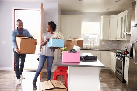 Happy homebuyers moving into their new home