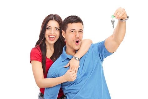 joyful-couple-holding-a-key