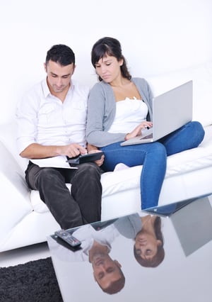 Couple analyzing their finances in preparation for buying a home in Norwood, Massachusetts