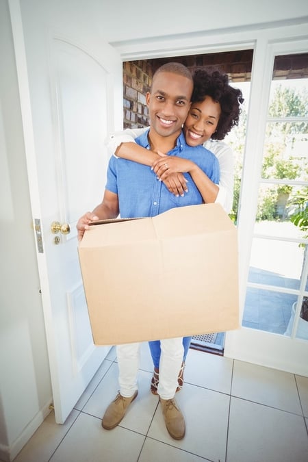 A couple entering their New Hampshire home