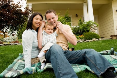 couple with a newborn at their new home. 