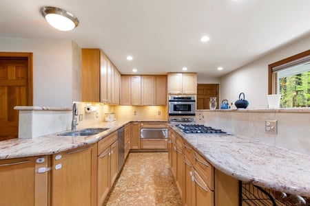 Kitchen with oak cabinets and granite countertops